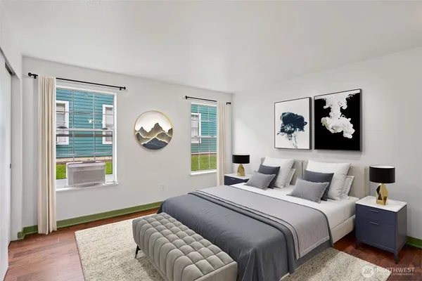 a bedroom with a bed and a window