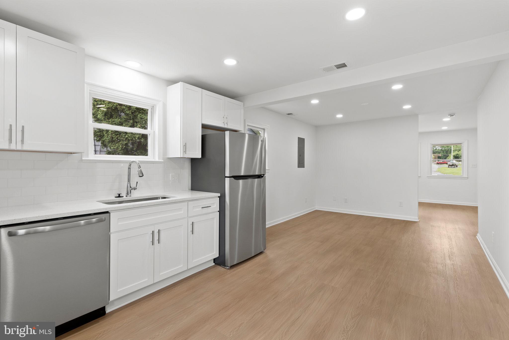 554 Compass Road East Baltimore, MD 21220 - Photo 11 of 24 a kitchen with a refrigerator and a sink