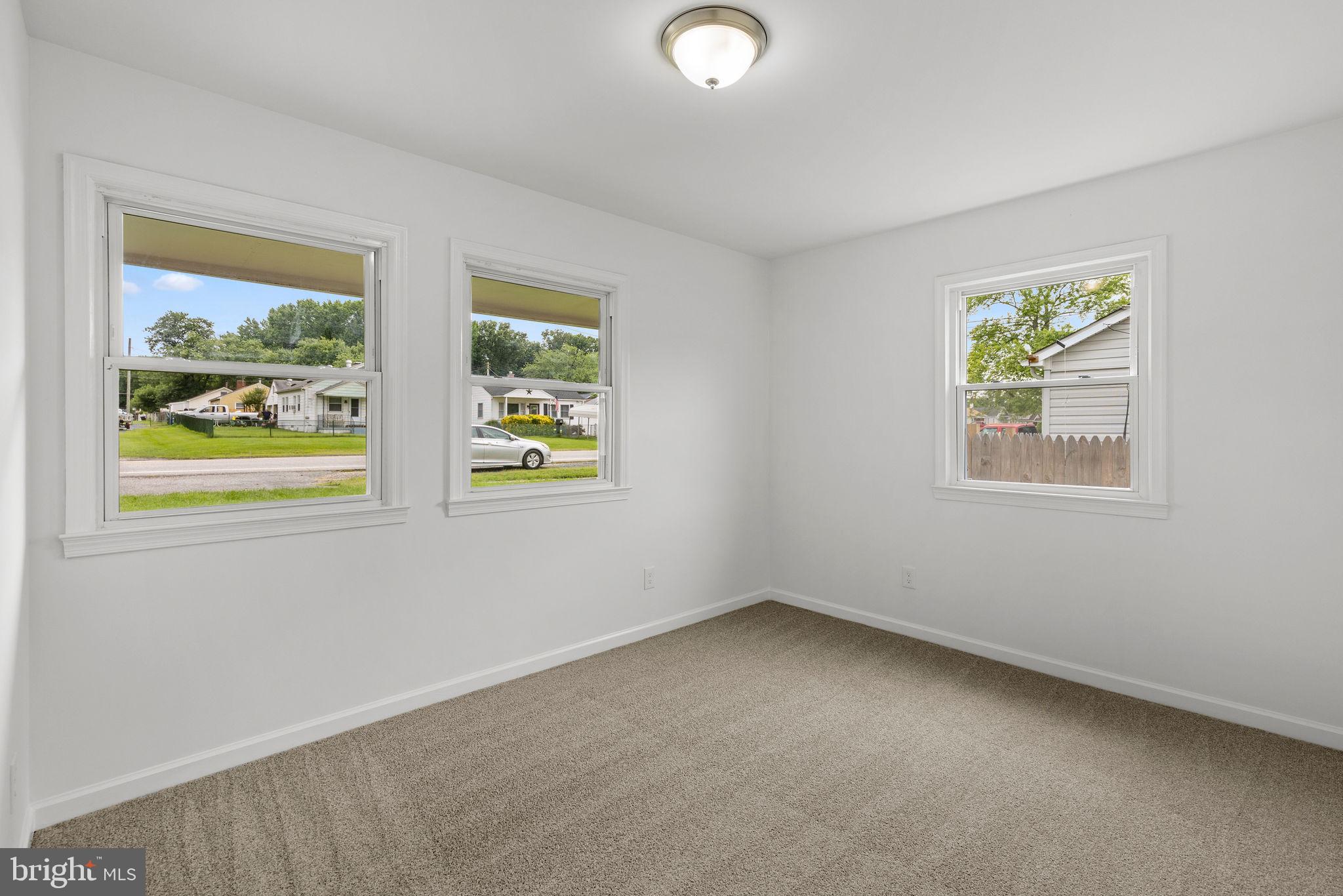 554 Compass Road East Baltimore, MD 21220 - Photo 12 of 24 an empty room with windows