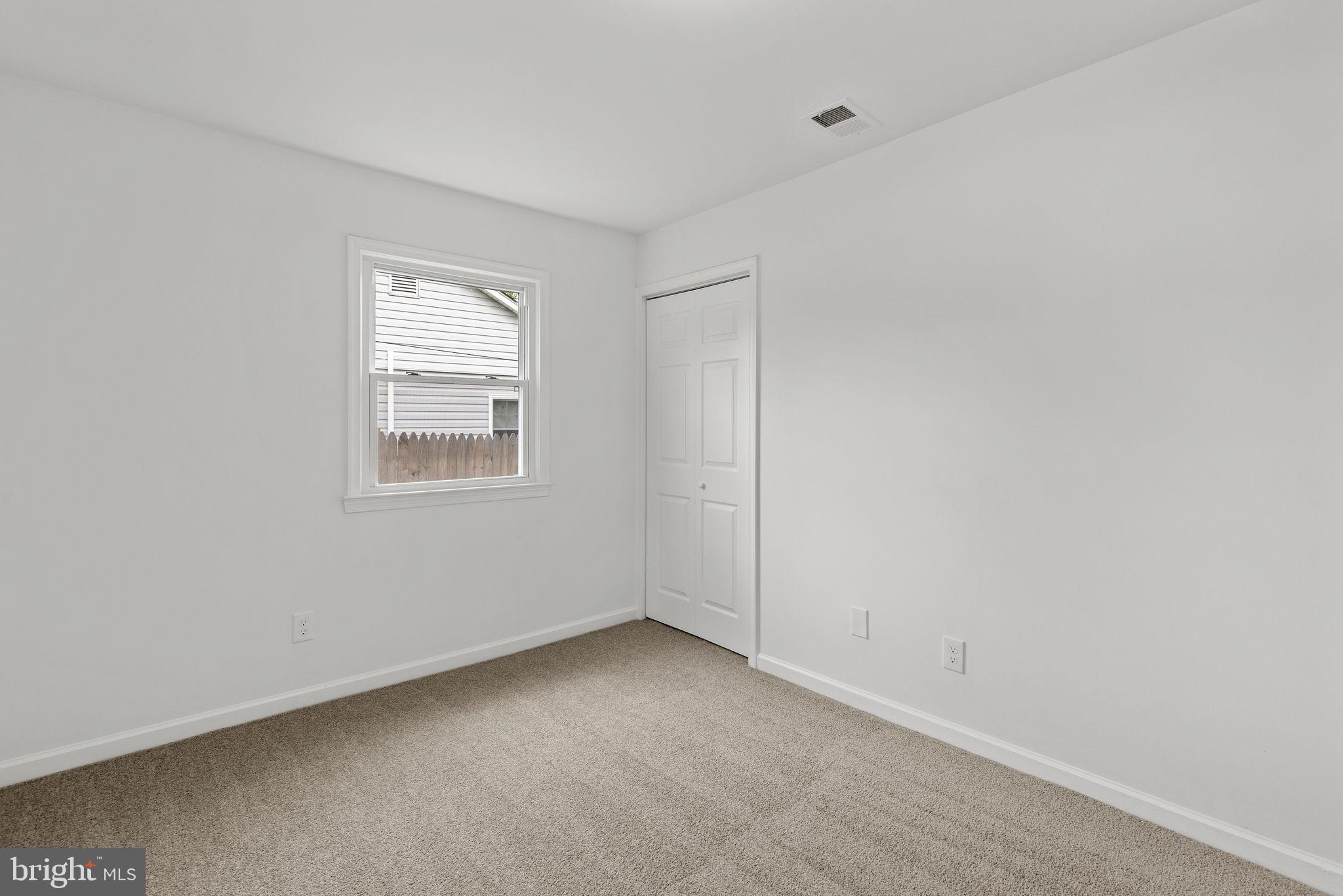 554 Compass Road East Baltimore, MD 21220 - Photo 13 of 24 a view of an empty room with a window