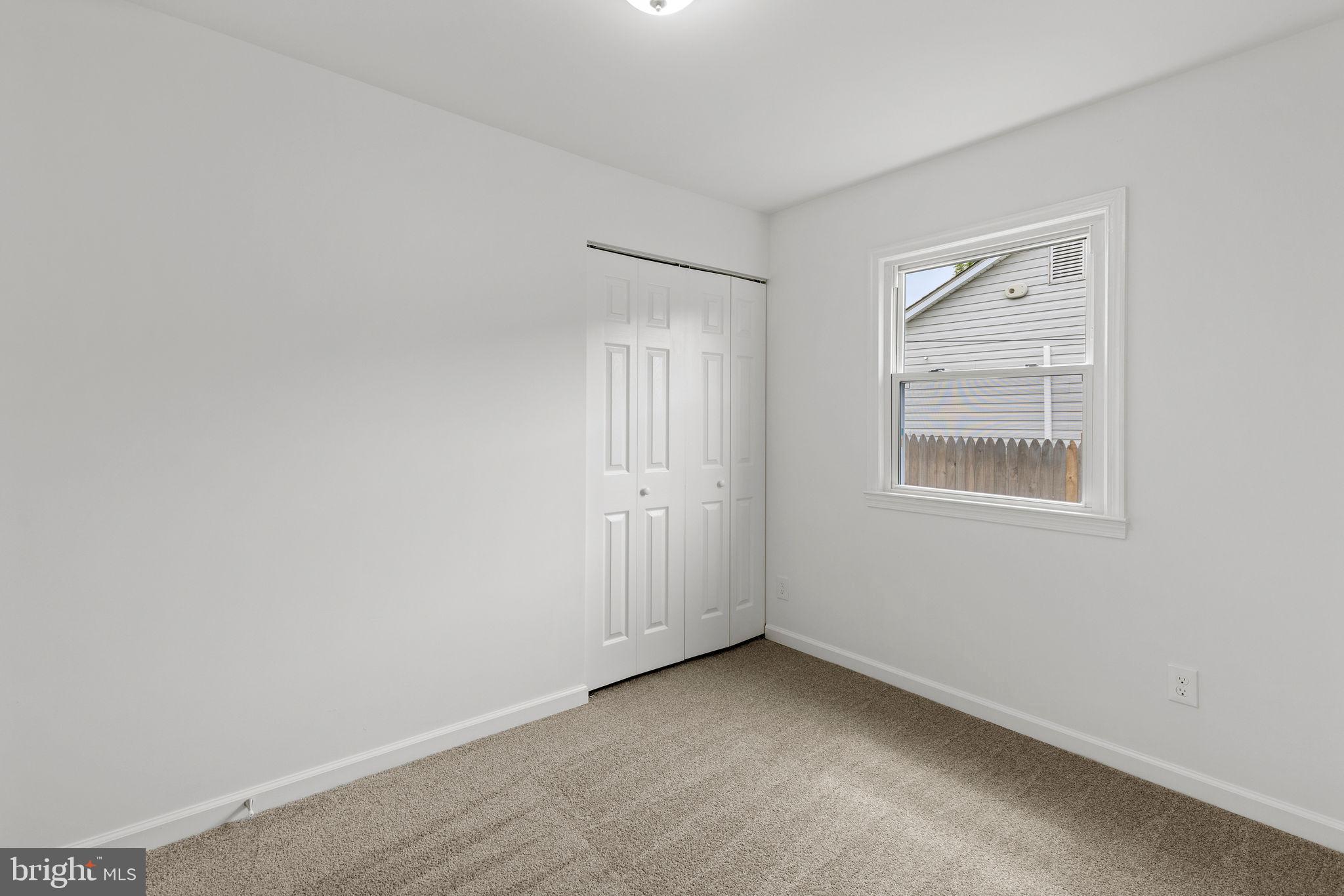 554 Compass Road East Baltimore, MD 21220 - Photo 15 of 24 an empty room with windows
