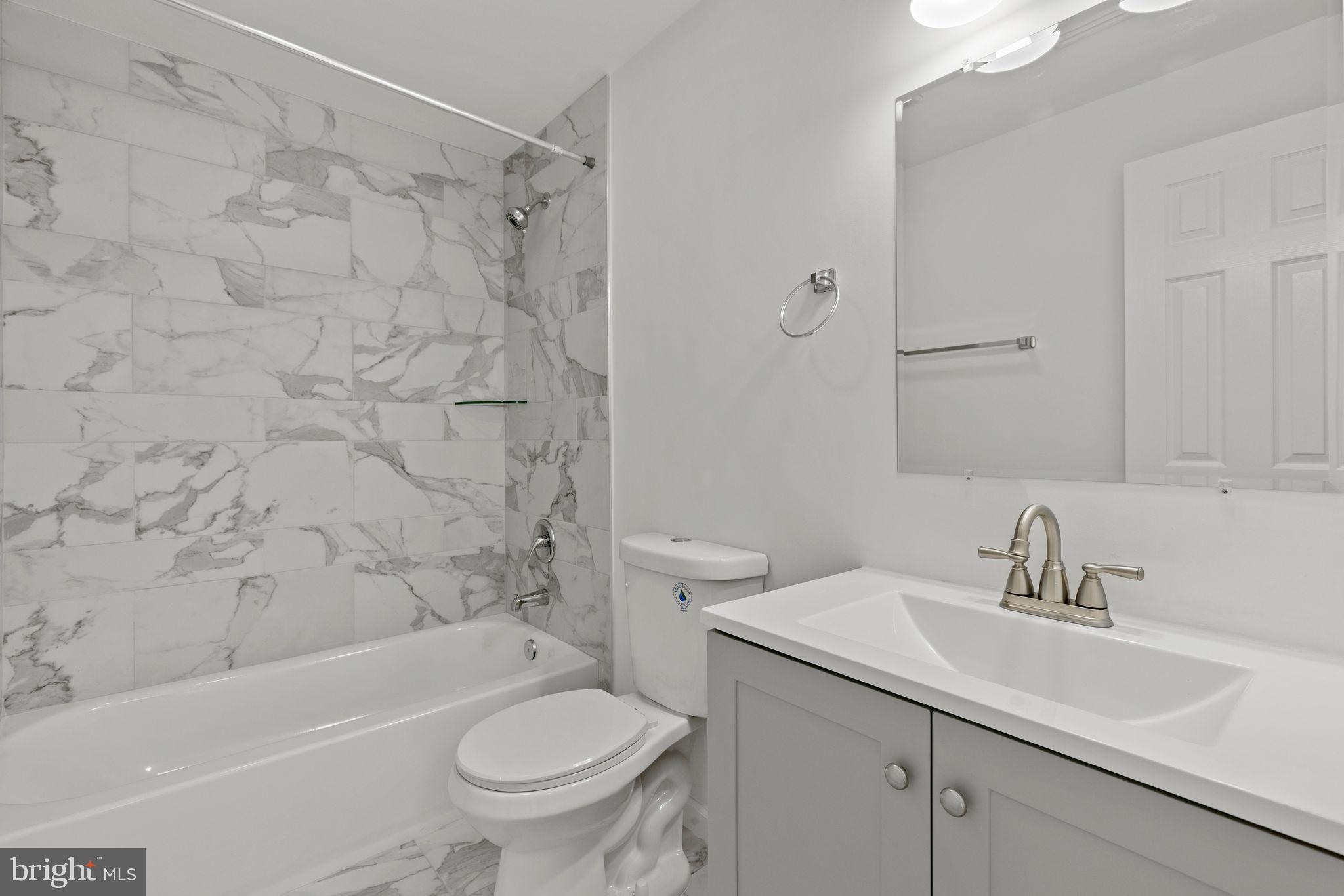 554 Compass Road East Baltimore, MD 21220 - Photo 18 of 24 a bathroom with a sink toilet and shower