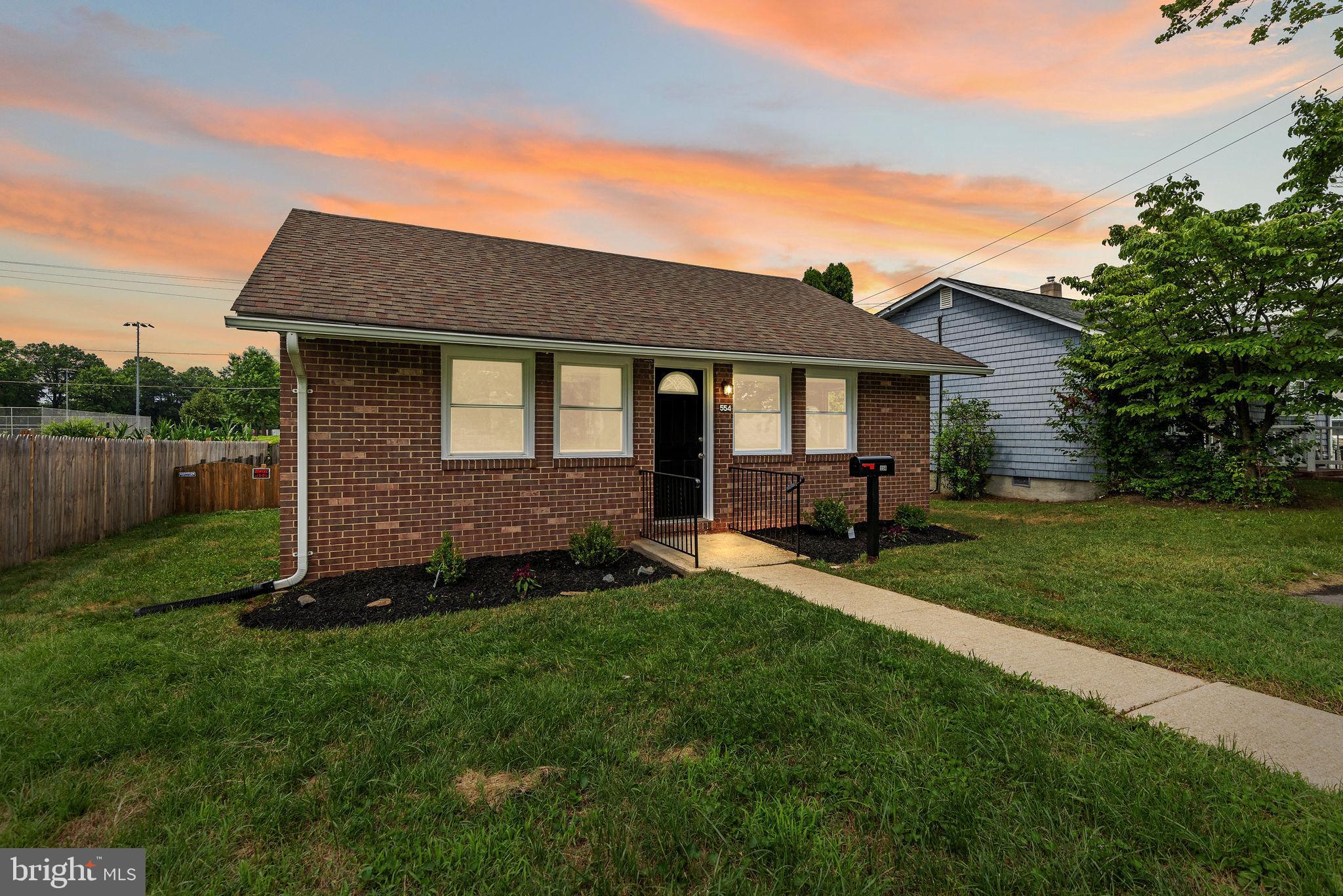 554 Compass Road East Baltimore, MD 21220 - Photo 2 of 24 a front view of a house with a yard and yard