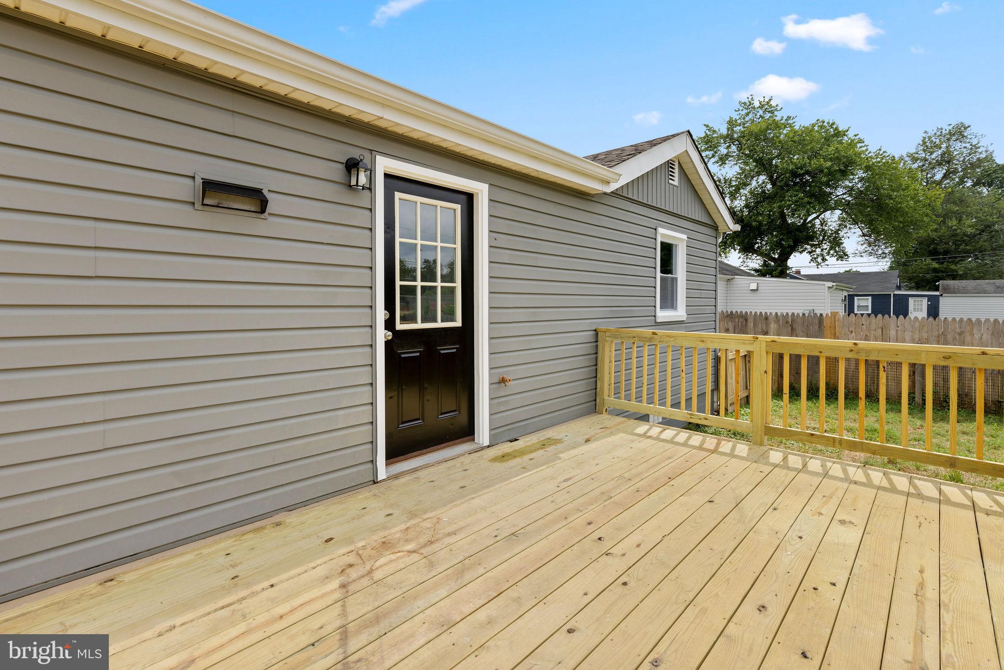 554 Compass Road East Baltimore, MD 21220 - Photo 22 of 24 a view of a wooden deck