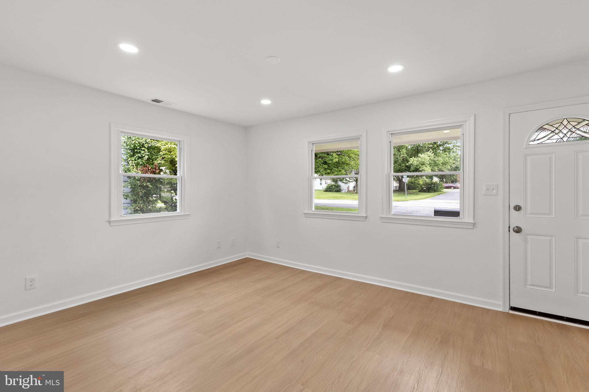 554 Compass Road East Baltimore, MD 21220 - Photo 7 of 24 an empty room with windows