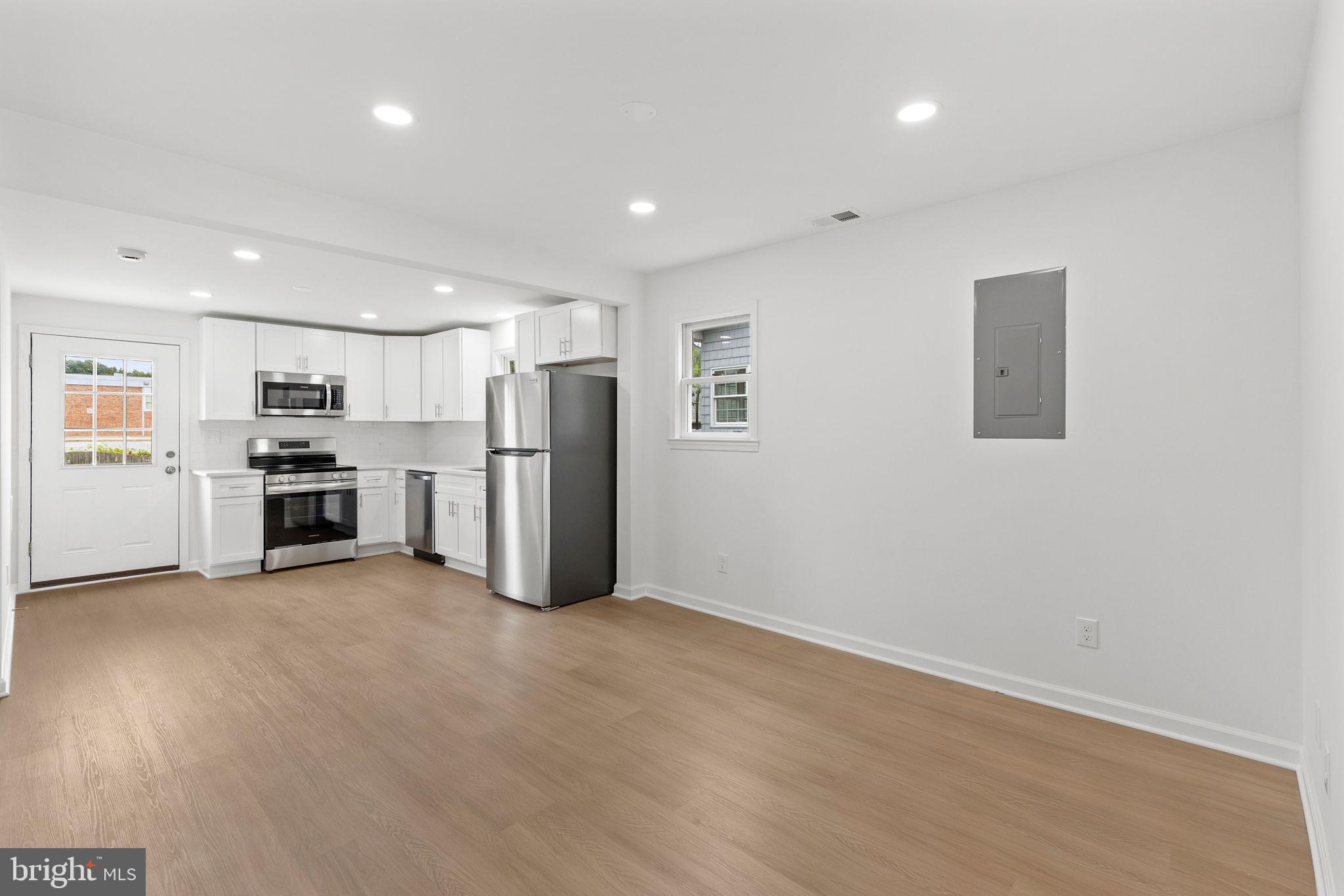 554 Compass Road East Baltimore, MD 21220 - Photo 9 of 24 a view of kitchen with refrigerator and microwave