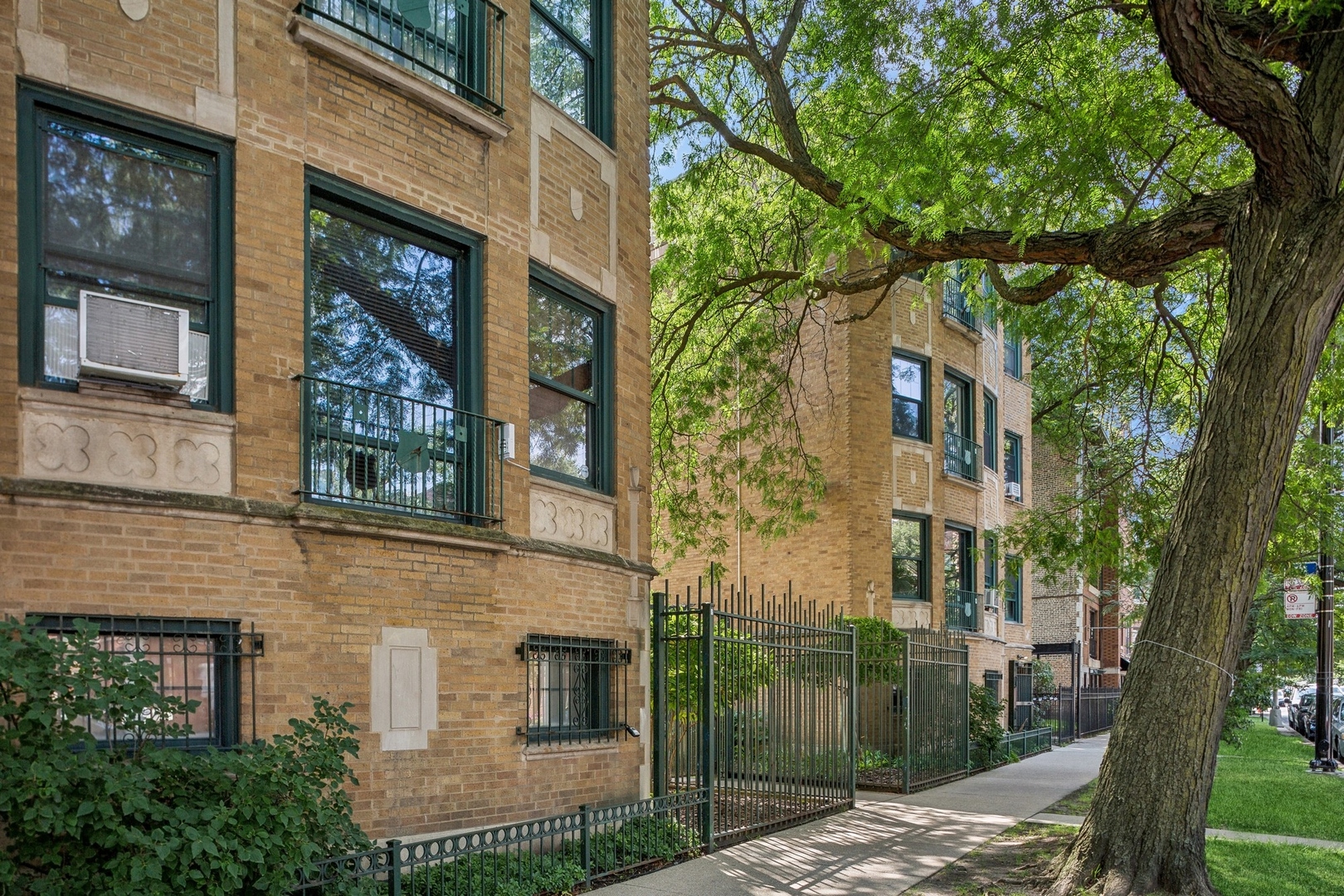 7025 North Sheridan Road, Unit 3N Chicago, IL 60626 - Photo 2 of 14 a view of a brick house with a large windows