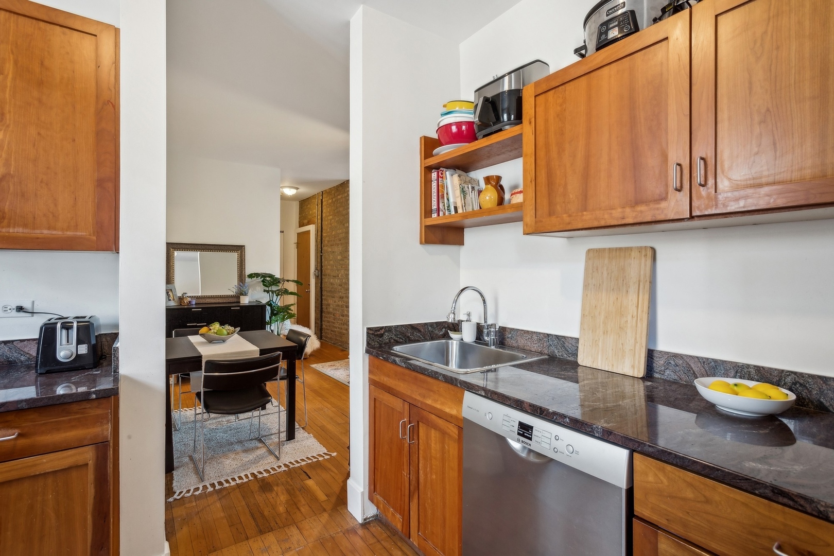 7025 North Sheridan Road, Unit 3N Chicago, IL 60626 - Photo 7 of 14 a kitchen with a sink and cabinets
