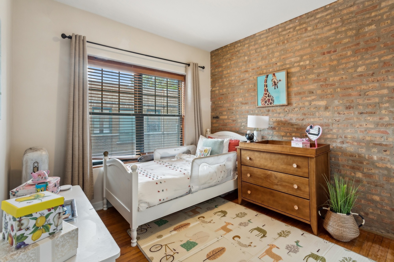 7025 North Sheridan Road, Unit 3N Chicago, IL 60626 - Photo 10 of 14 a bedroom with a bed and a window