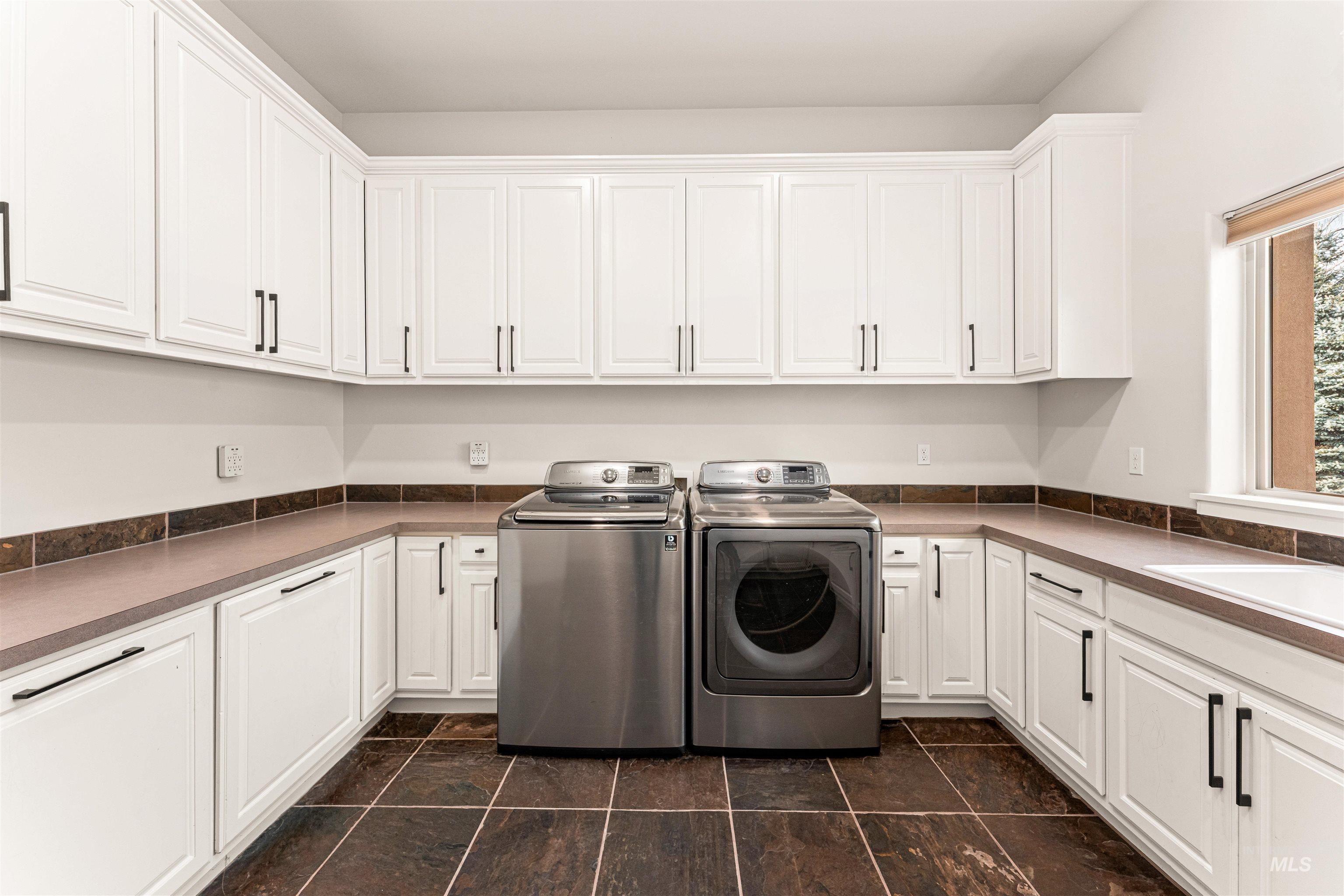 4262 South Rustler Lane Meridian, ID 83642 - Photo 38 of 50 Washroom featuring washer and dryer and cabinet space