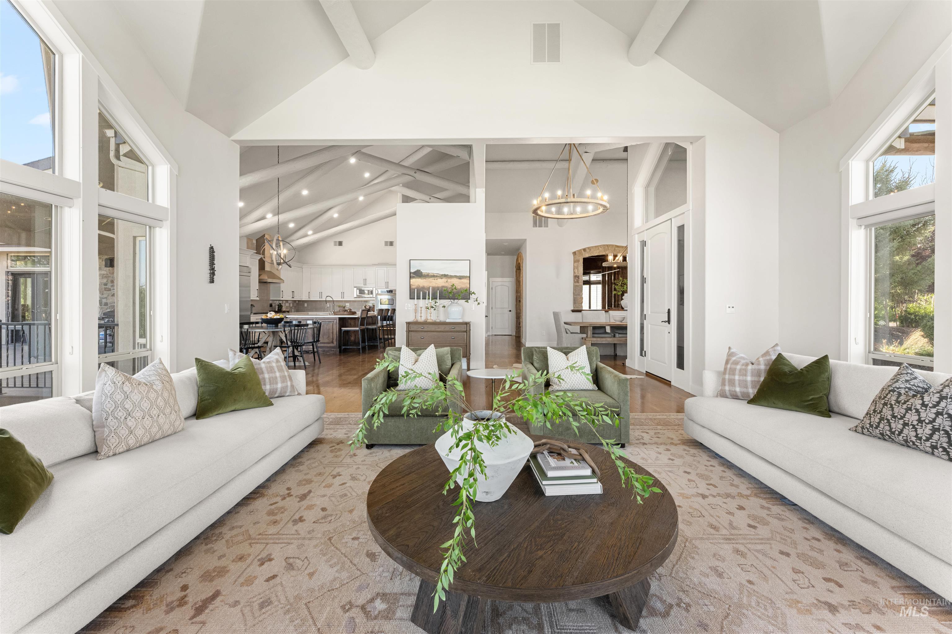 4262 South Rustler Lane Meridian, ID 83642 - Photo 8 of 50 Living area with a chandelier, plenty of natural light, beamed ceiling, high vaulted ceiling, and recessed lighting