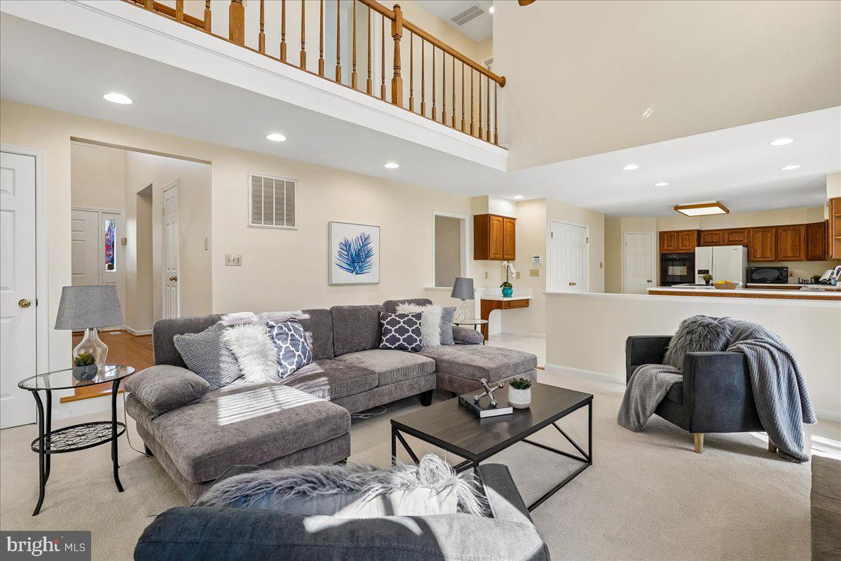 8501 Silverview Drive Lorton, VA 22079 - Photo 20 of 72 a living room with furniture and view of kitchen