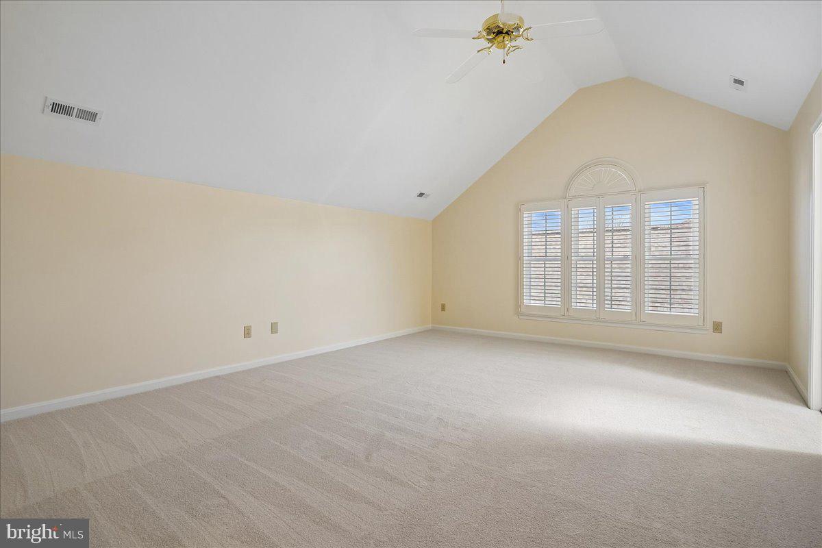 8501 Silverview Drive Lorton, VA 22079 - Photo 37 of 72 an empty room with windows and chandelier fan