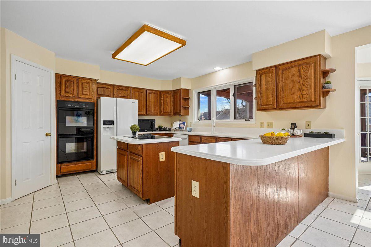8501 Silverview Drive Lorton, VA 22079 - Photo 4 of 72 a kitchen with stainless steel appliances granite countertop a refrigerator and a stove top oven