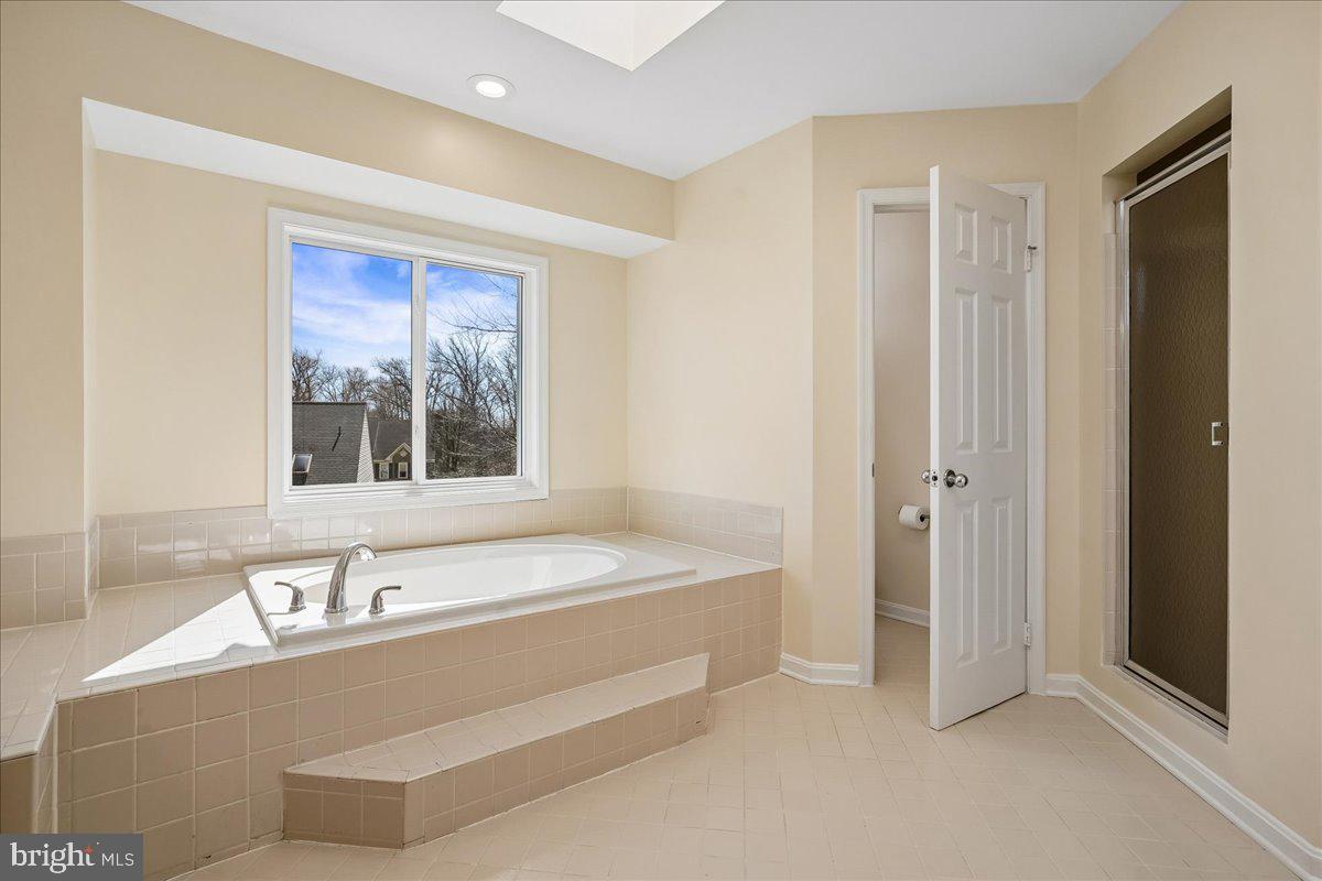 8501 Silverview Drive Lorton, VA 22079 - Photo 43 of 72 a spacious bathroom with a bathtub and a sink