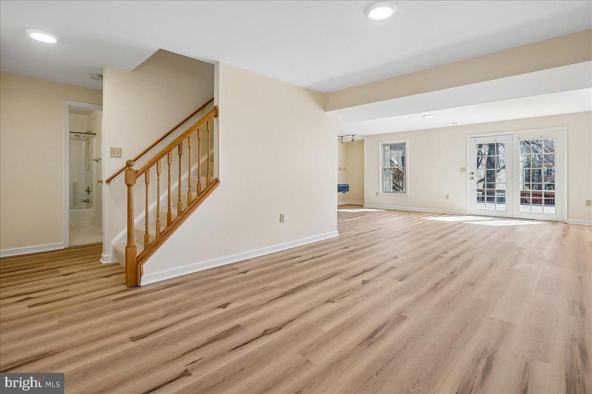 8501 Silverview Drive Lorton, VA 22079 - Photo 54 of 72 a view of an empty room with wooden floor and stairs