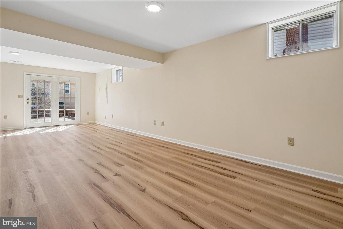 8501 Silverview Drive Lorton, VA 22079 - Photo 56 of 72 a view of an empty room with wooden floor and a window