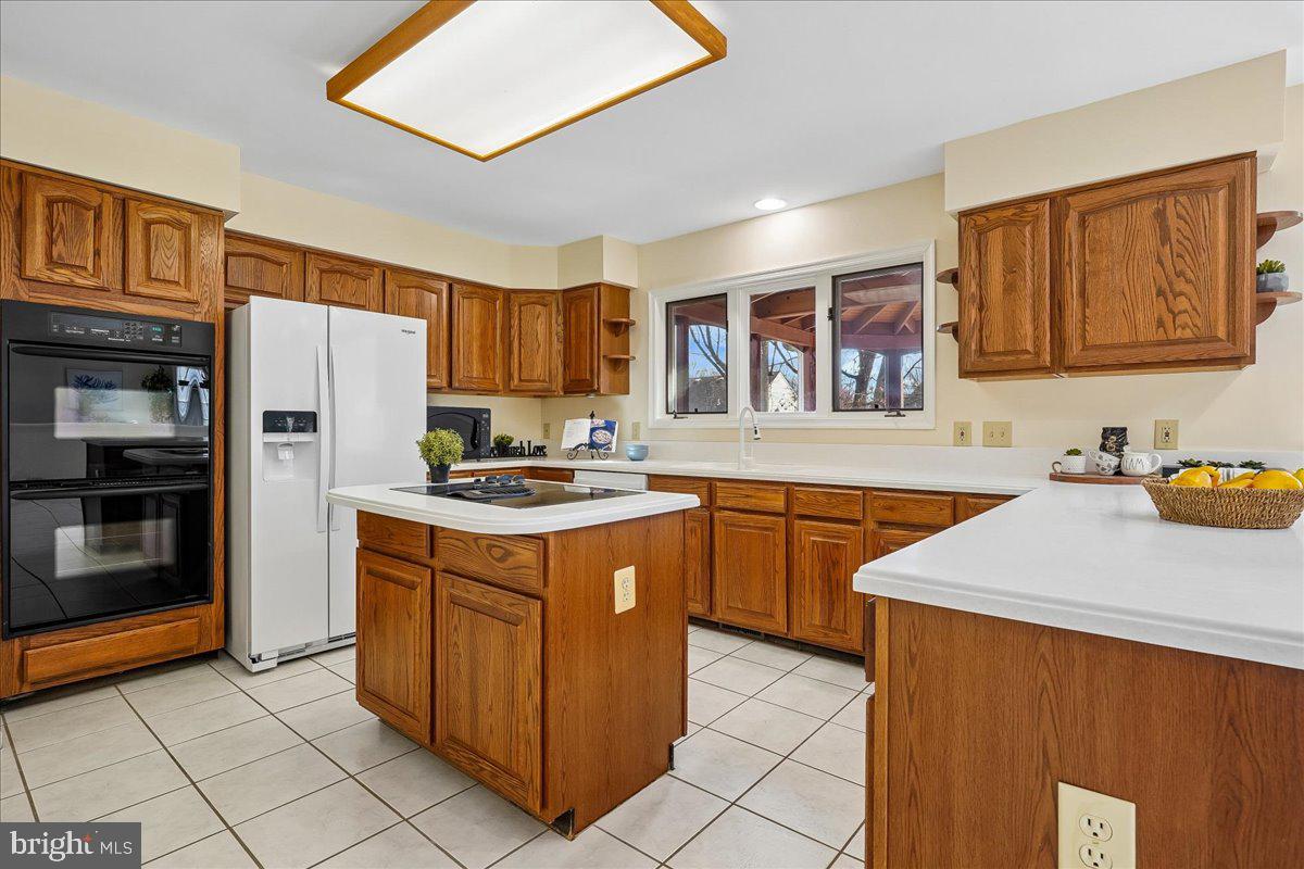 8501 Silverview Drive Lorton, VA 22079 - Photo 6 of 72 a kitchen with stainless steel appliances granite countertop a refrigerator stove top oven and sink