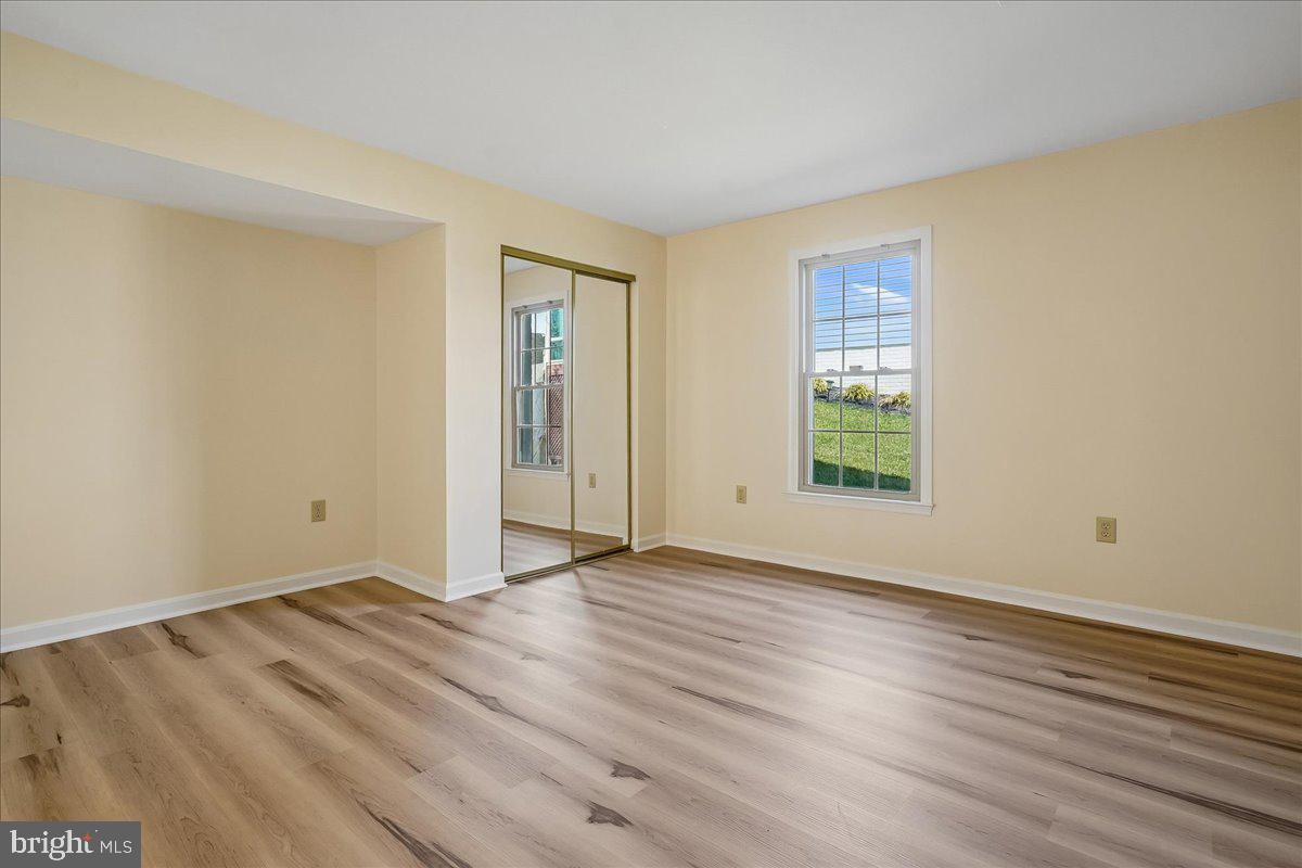 8501 Silverview Drive Lorton, VA 22079 - Photo 61 of 72 a view of an empty room with wooden floor and a window