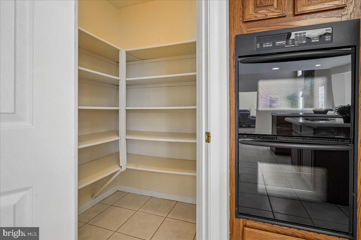 8501 Silverview Drive Lorton, VA 22079 - Photo 10 of 72 a kitchen with a stove and a microwave