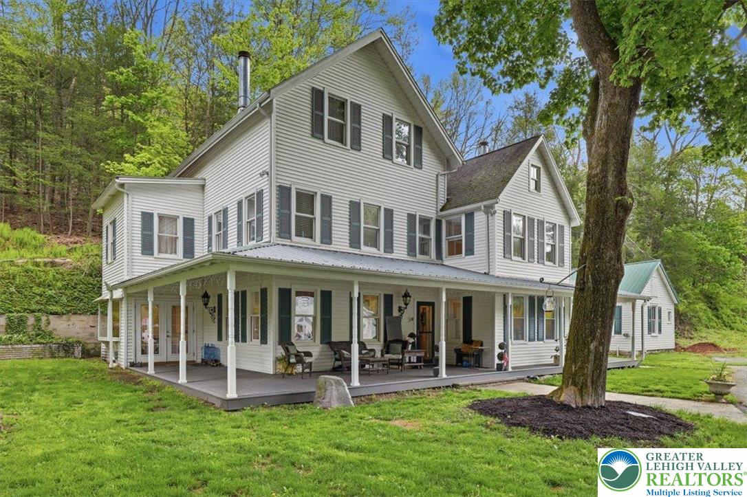 3585 Fairyland Road Lehighton, PA 18235 - Photo 57 of 57 a front view of a house with a yard table and chairs
