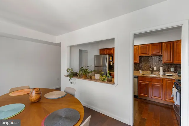 a kitchen with a table and chairs in it