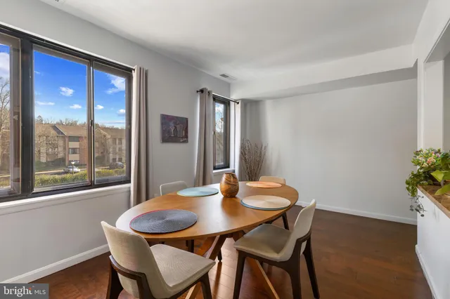 a view of a dining room with furniture and window