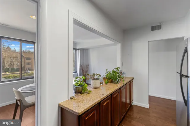 a view of an entryway and kitchen