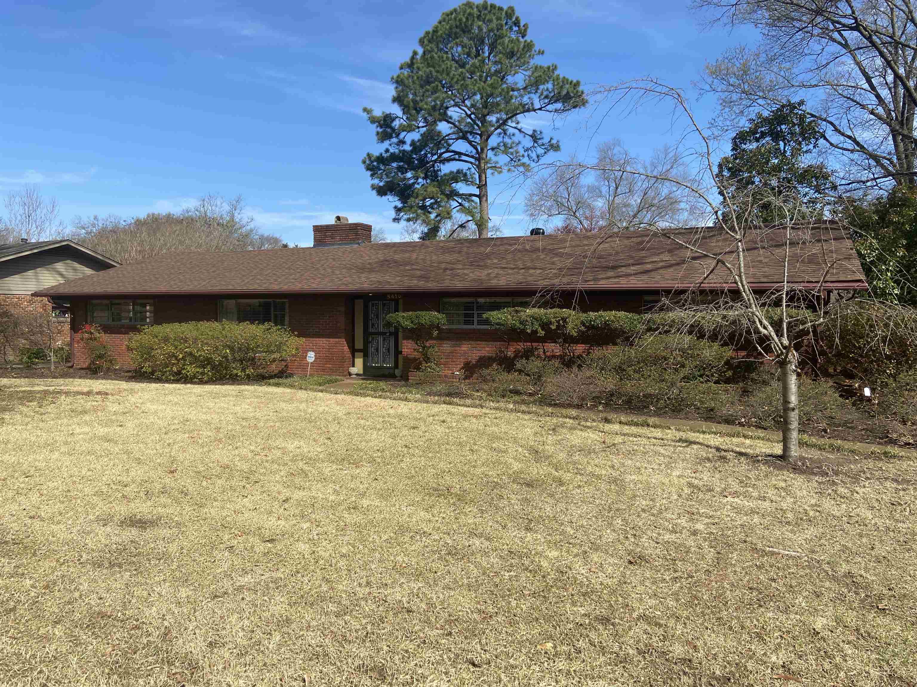 5410 Walnut Grove Road Memphis, TN 38120 - Photo 1 of 16 a front view of a house with a yard