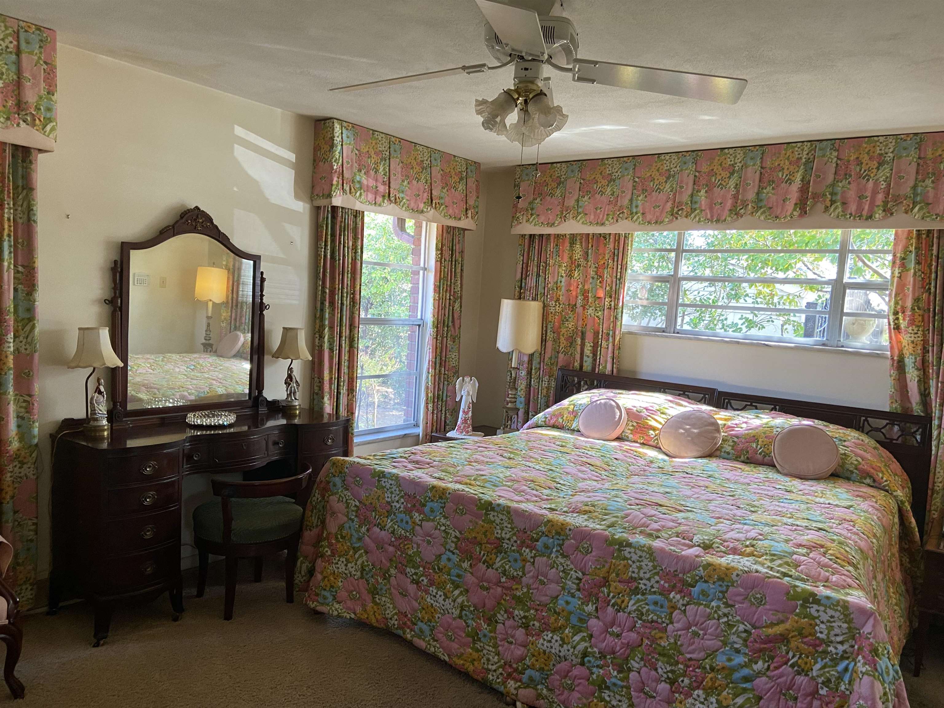 5410 Walnut Grove Road Memphis, TN 38120 - Photo 15 of 16 a bedroom with a bed and a mirror