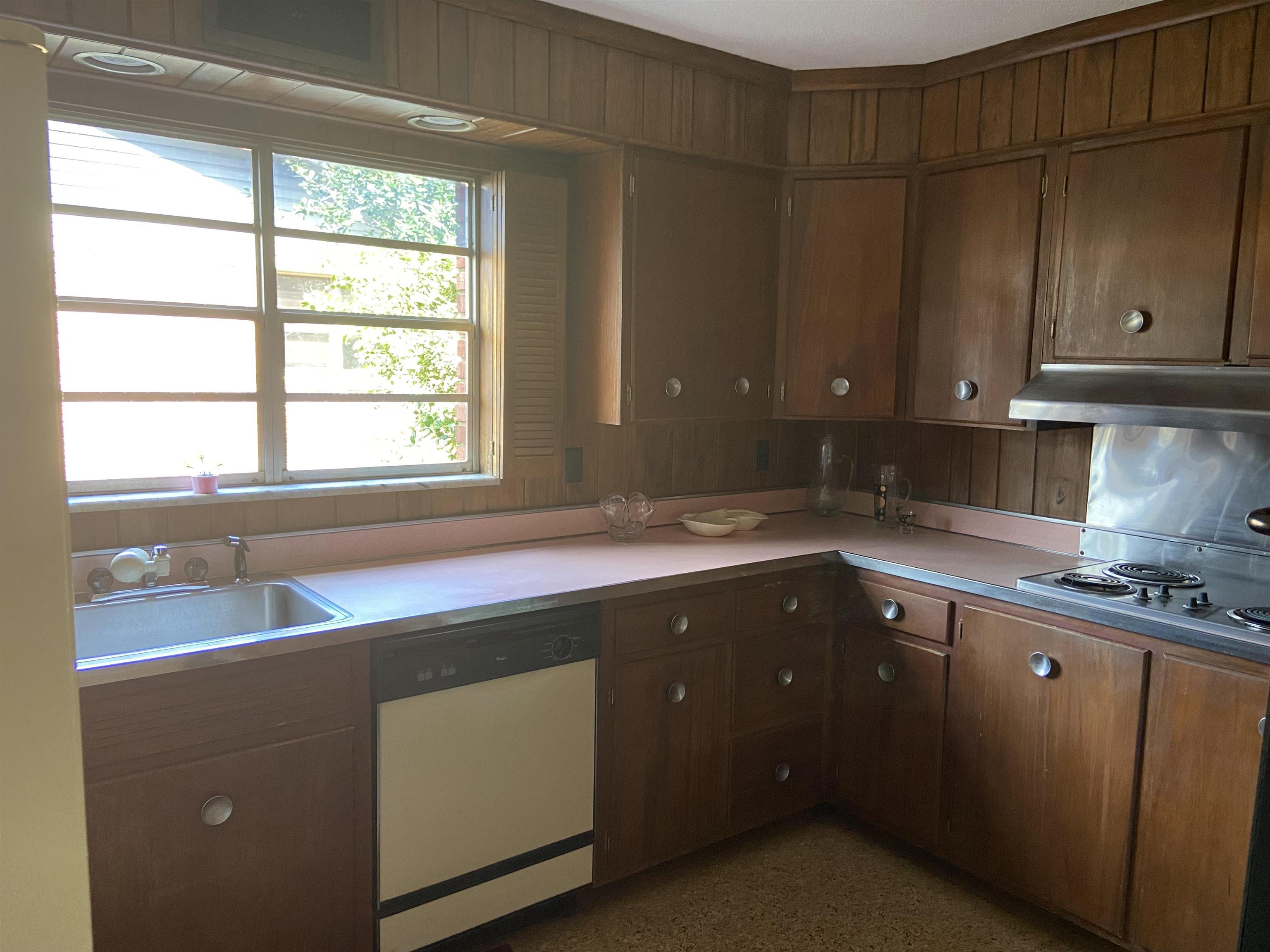 5410 Walnut Grove Road Memphis, TN 38120 - Photo 16 of 16 a kitchen with a sink and cabinets