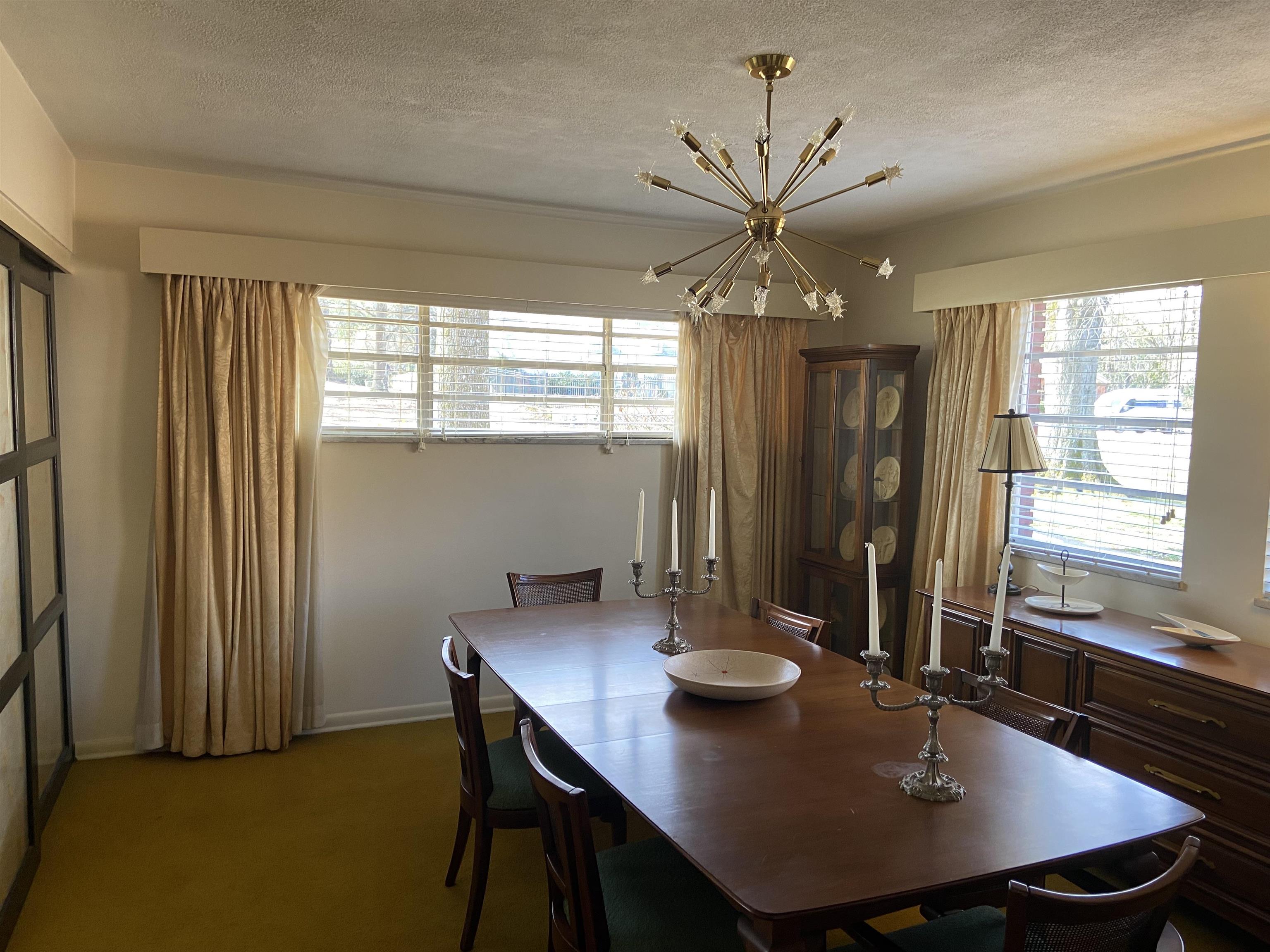 5410 Walnut Grove Road Memphis, TN 38120 - Photo 8 of 16 a view of a dining room with a table and chairs