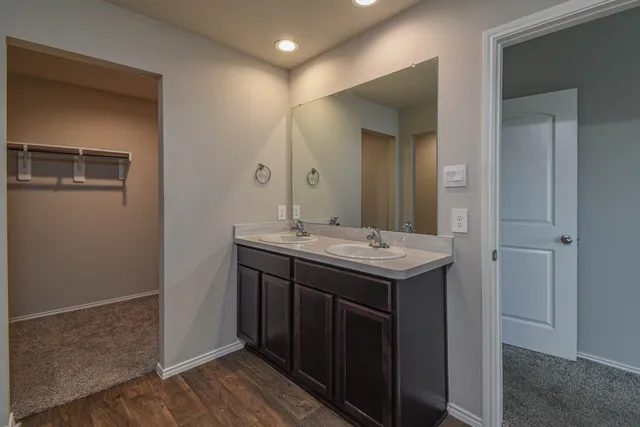 a bathroom with a sink and mirror