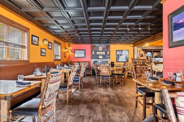 a view of a chairs and table in a room