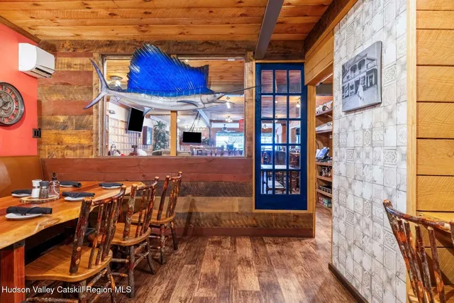 a view of a swimming pool with outdoor seating