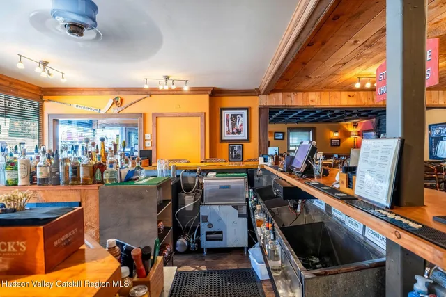 a kitchen with wooden cabinets and a stove top oven