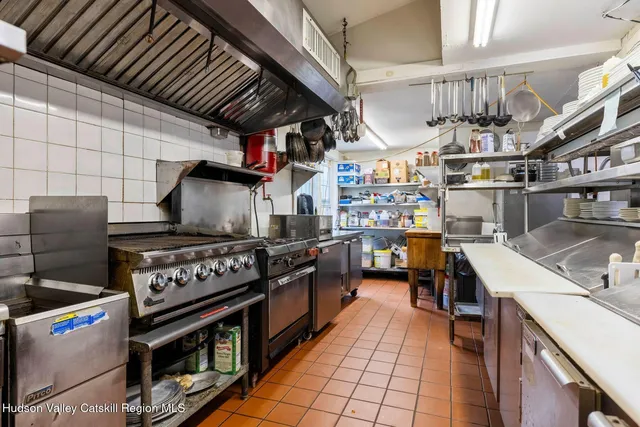 a view of balcony with chairs and wooden fence