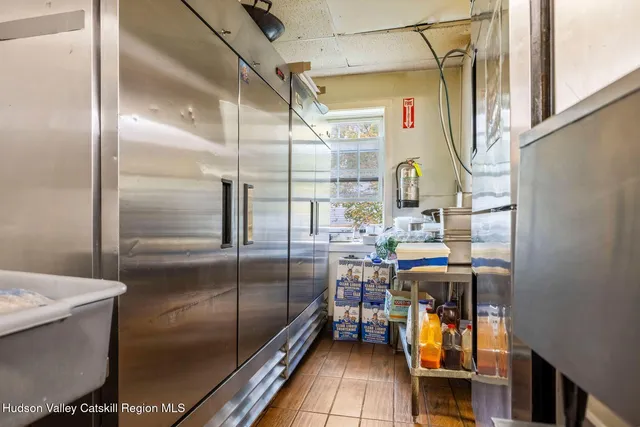 a view of a house with a tree