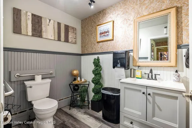 a kitchen with a sink cabinets and stainless steel appliances