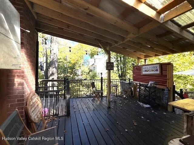 a kitchen with a sink and steel appliances