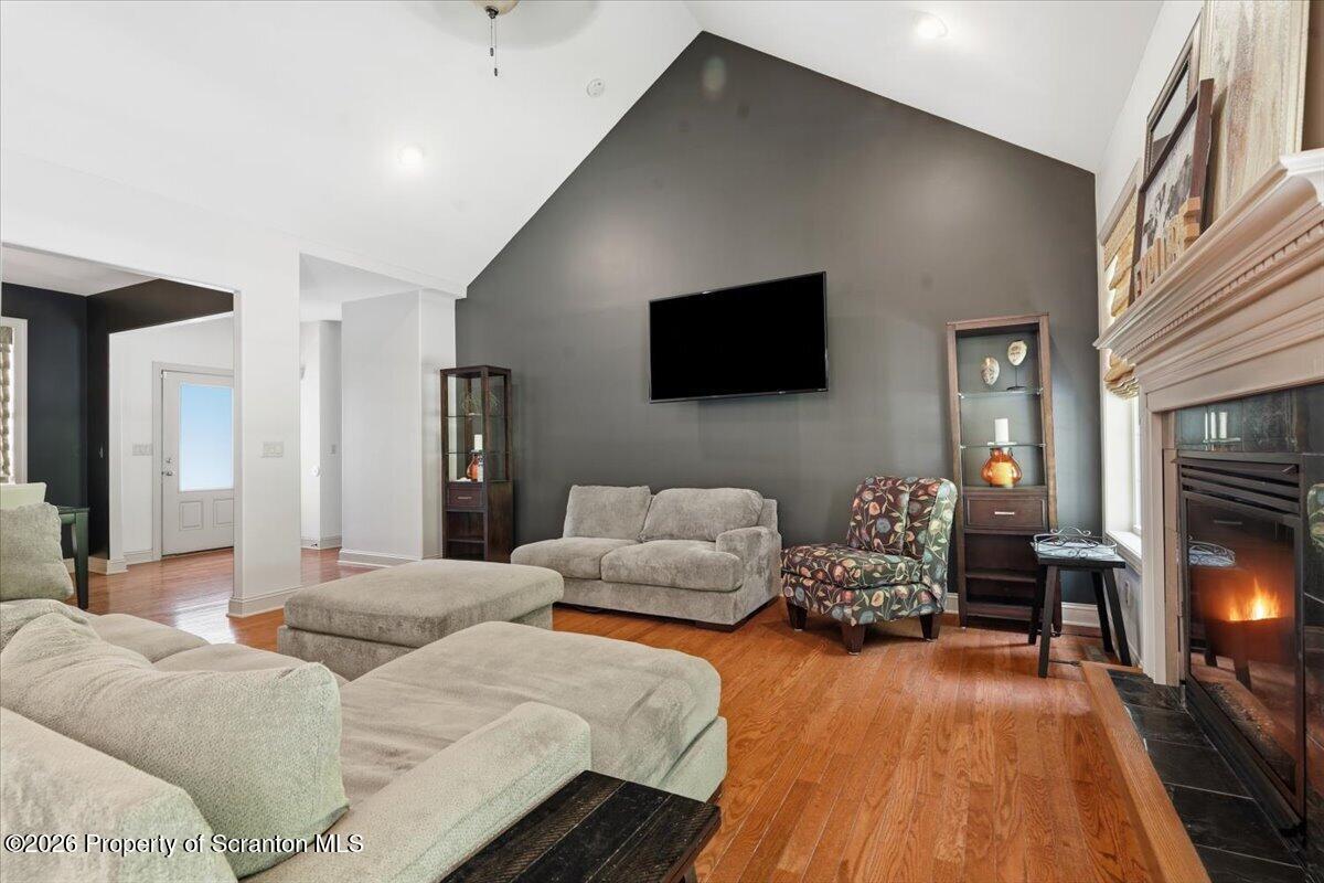 99 Hilltop Road Waverly, PA 18471 - Photo 8 of 41 a living room with furniture and a flat screen tv