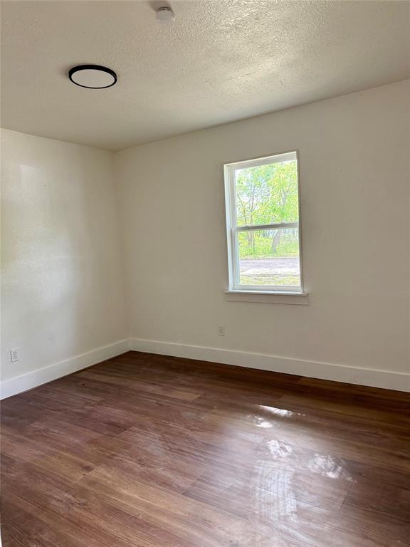 1114 Blackburn Street Commerce, TX 75428 - Photo 11 of 20 a view of a room that has a window in it