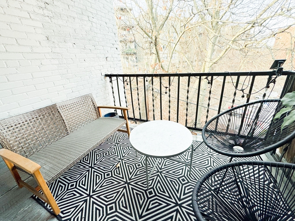 29 Mt Hood Road, Unit 12FURNISHED Boston, MA 02135 - Photo 11 of 11 a view of a balcony with wooden floor