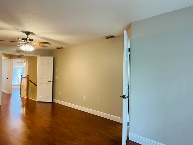 a view of a livingroom with wooden floor