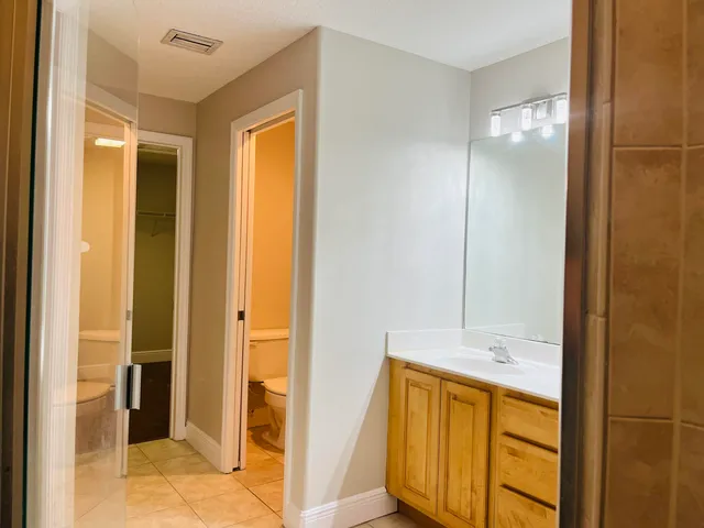 a bathroom with a tub and shower