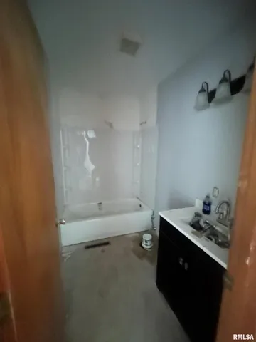 a bathroom with a sink and a tub