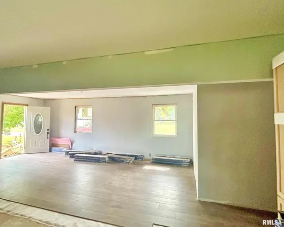 a view of a livingroom with wooden floor