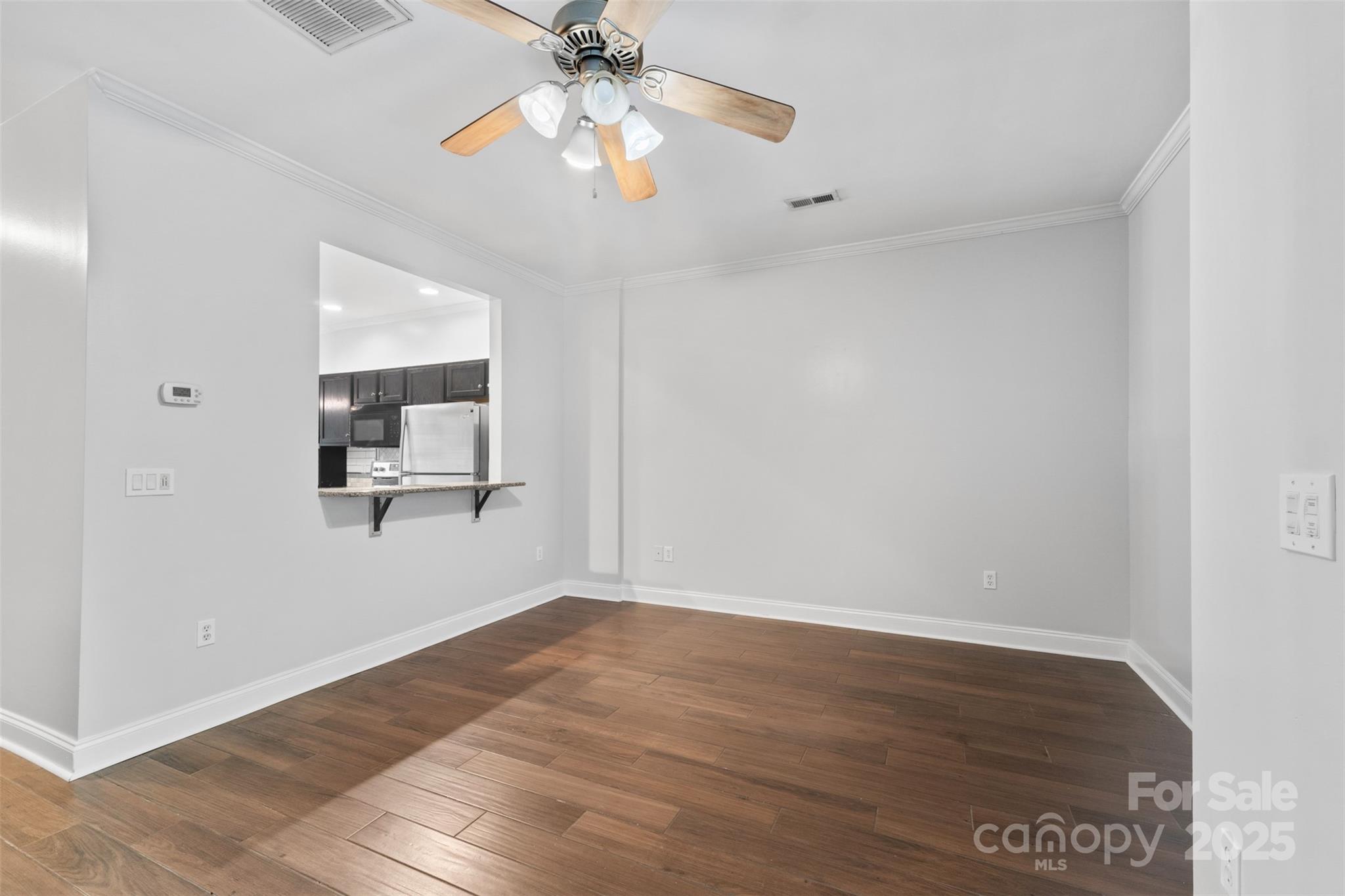 2476 Ryerson Court Charlotte, NC 28213 - Photo 14 of 30 wooden floor in an empty room with a window