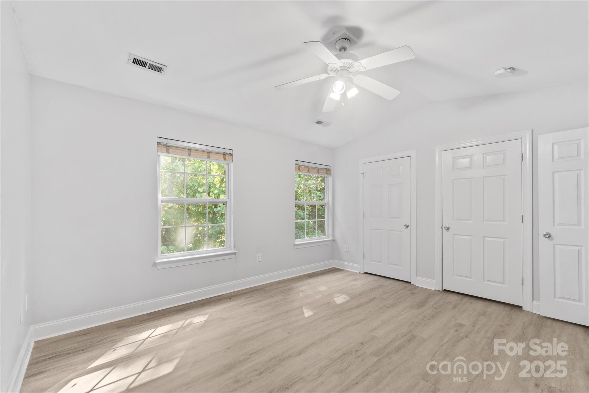 2476 Ryerson Court Charlotte, NC 28213 - Photo 17 of 30 wooden floor in an empty room with a window