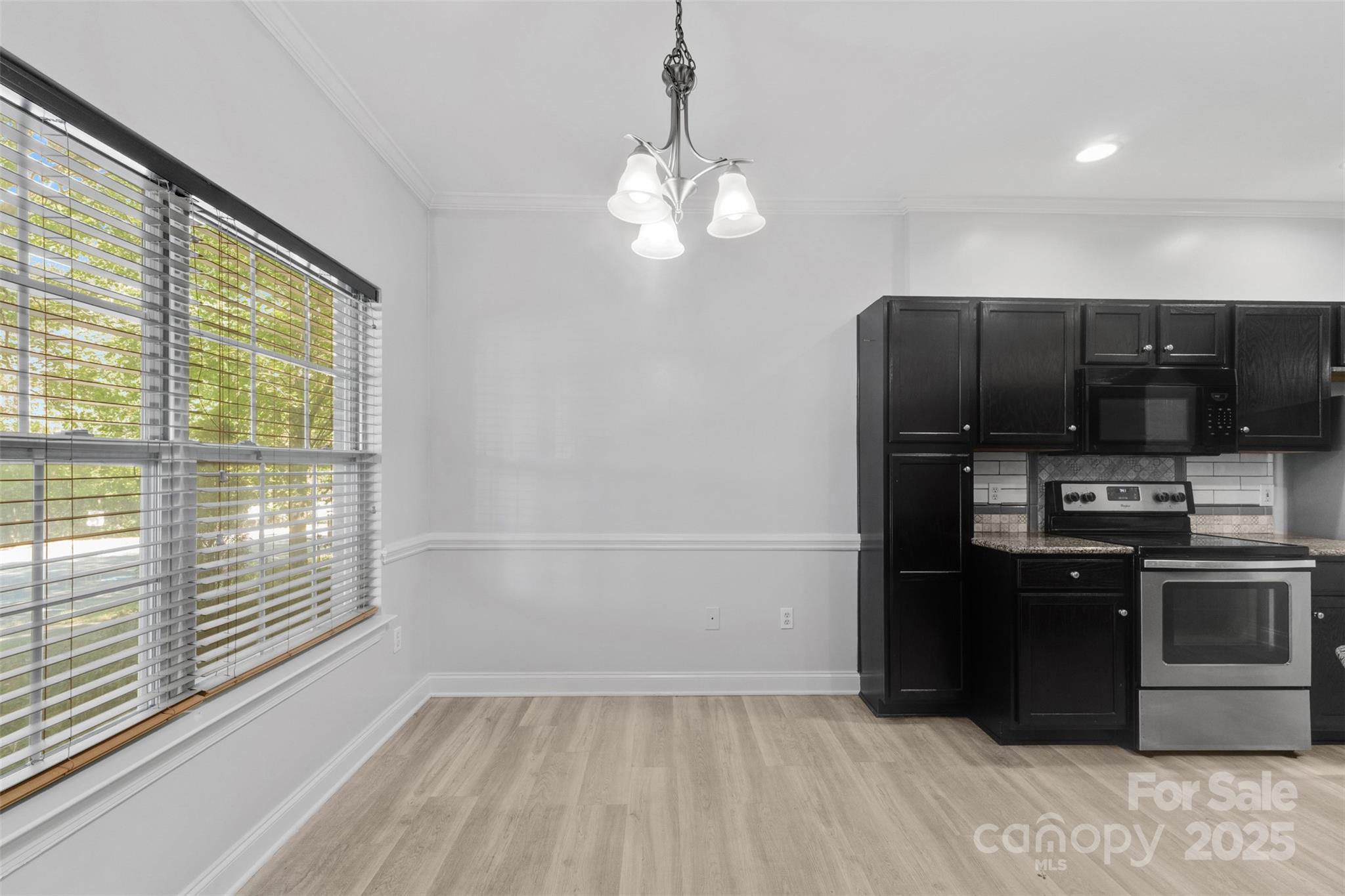 2476 Ryerson Court Charlotte, NC 28213 - Photo 5 of 30 a kitchen with stainless steel appliances granite countertop a refrigerator and a sink